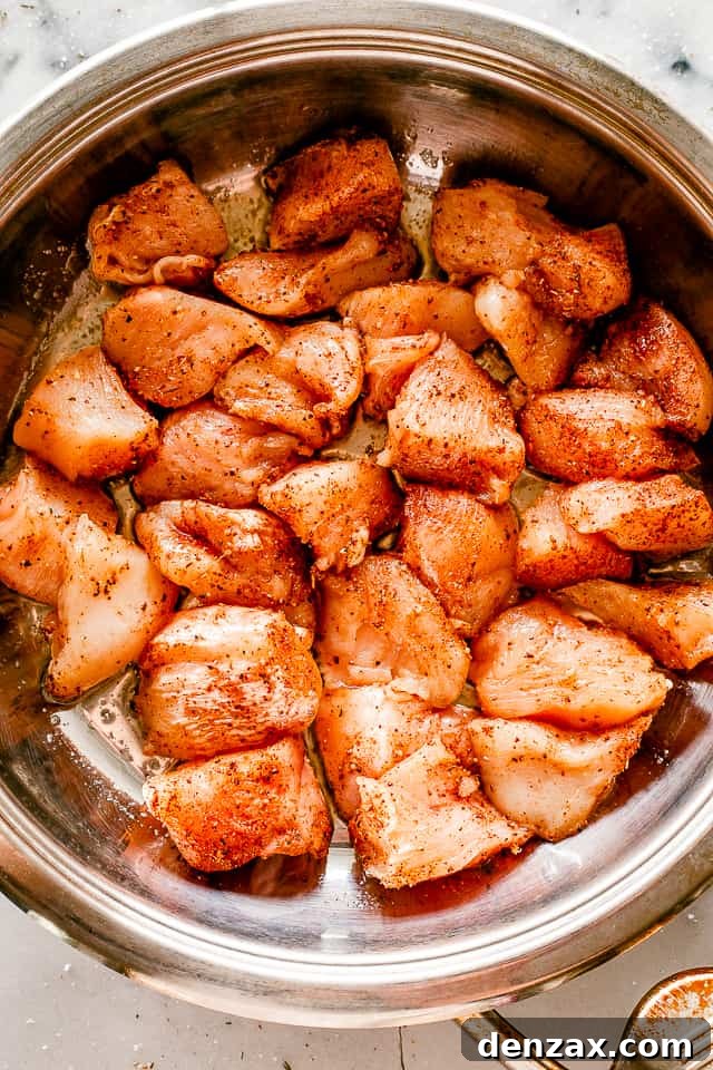 Taco chicken bites being cooked and browned in a hot skillet, showing the delicious crust forming.