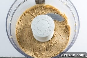 Hazelnuts transforming into butter in a food processor