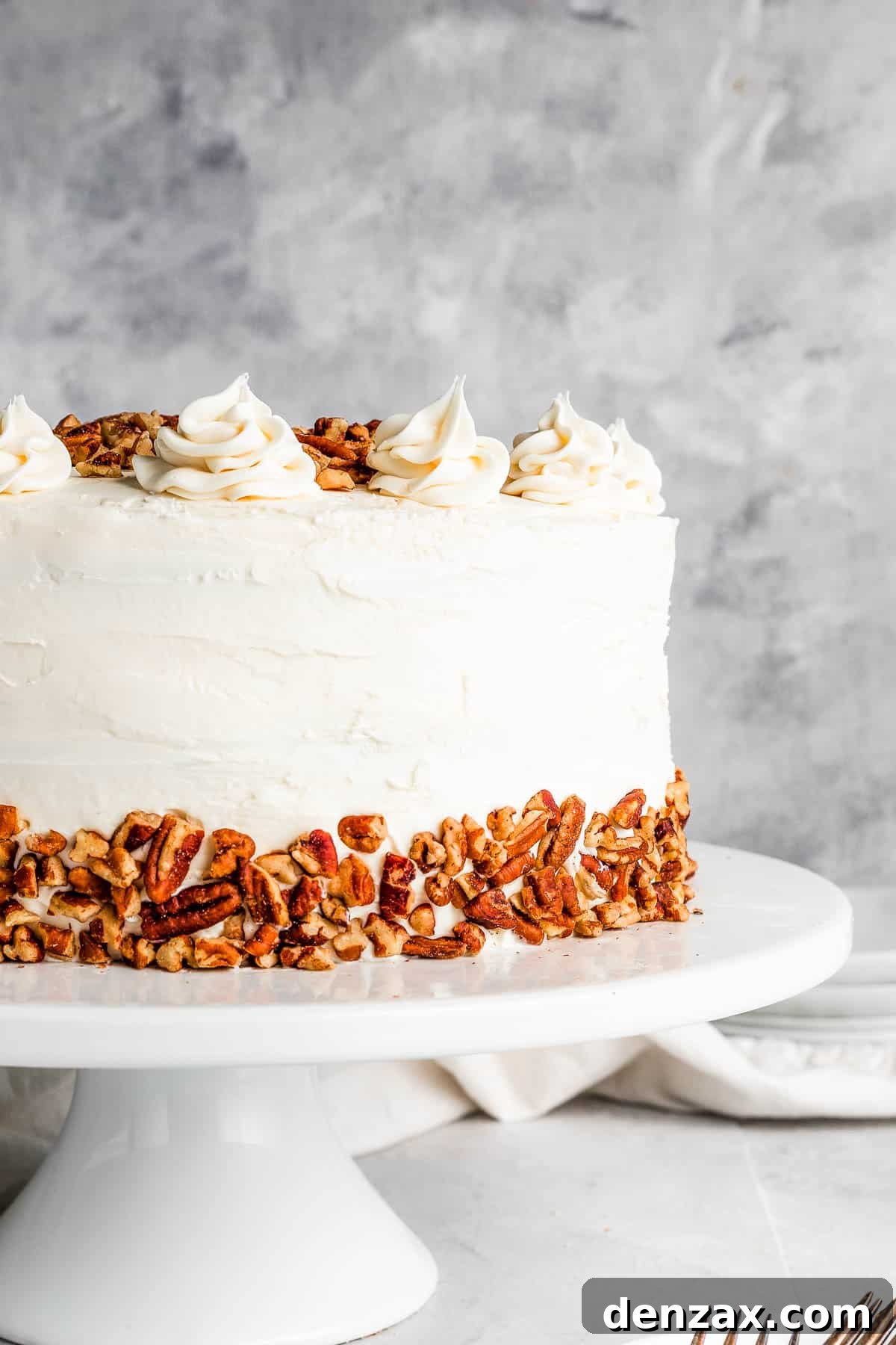 hummingbird cake on a white cake stand