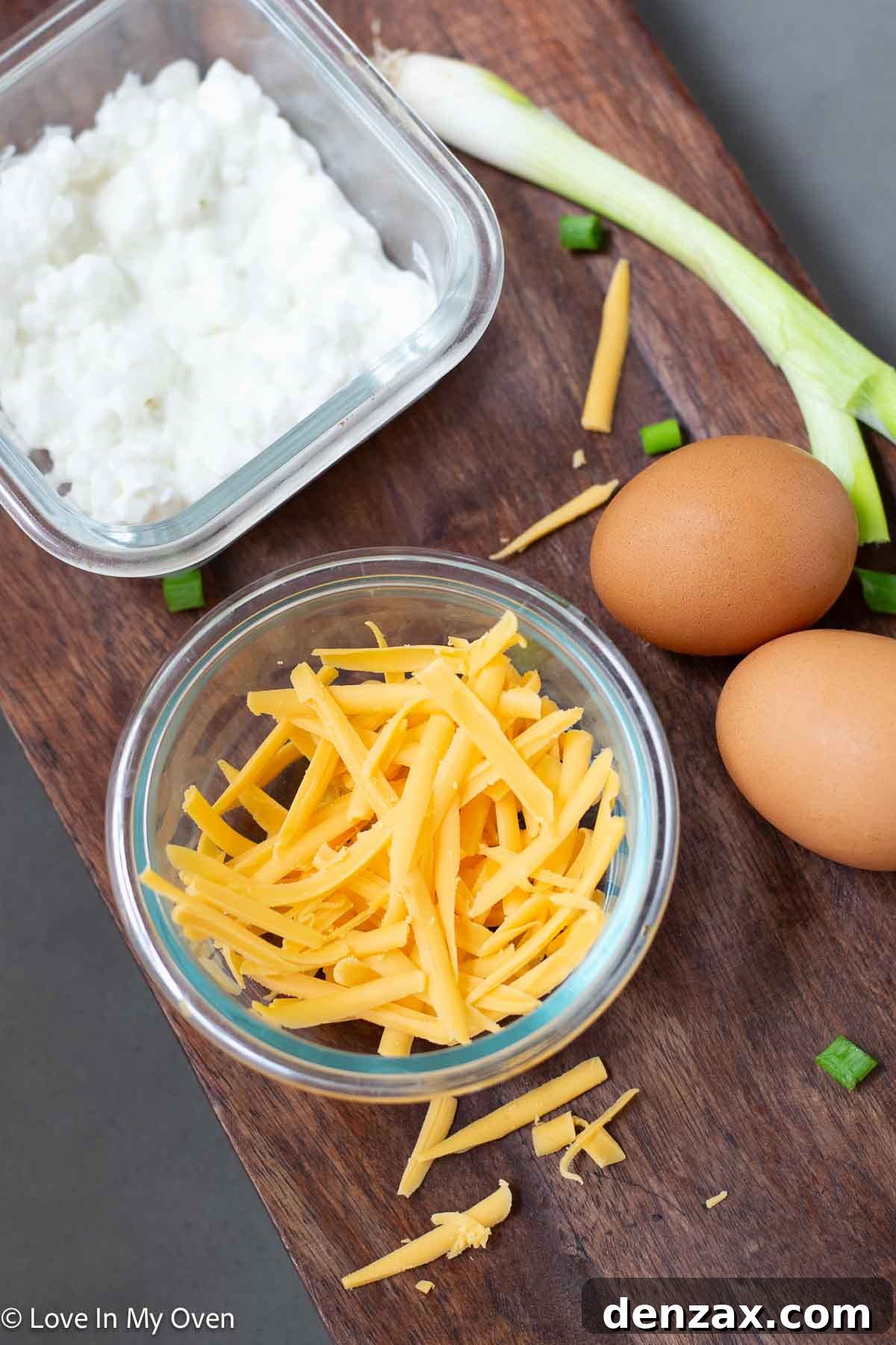 Fresh eggs, cottage cheese, and cheddar cheese ready for high protein scrambled eggs preparation
