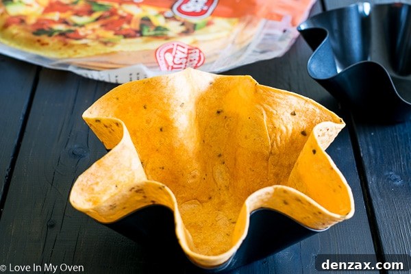 Baked tortilla shells, ready to be filled with delicious taco salad.