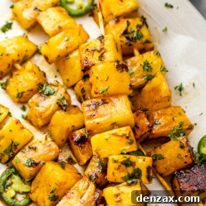 Tequila grilled pineapple skewers served on a plate