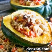 Moroccan Couscous Stuffed Acorn Squash on a wooden board