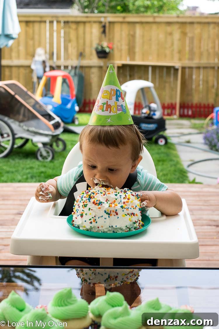 Baby enjoying healthy smash cake
