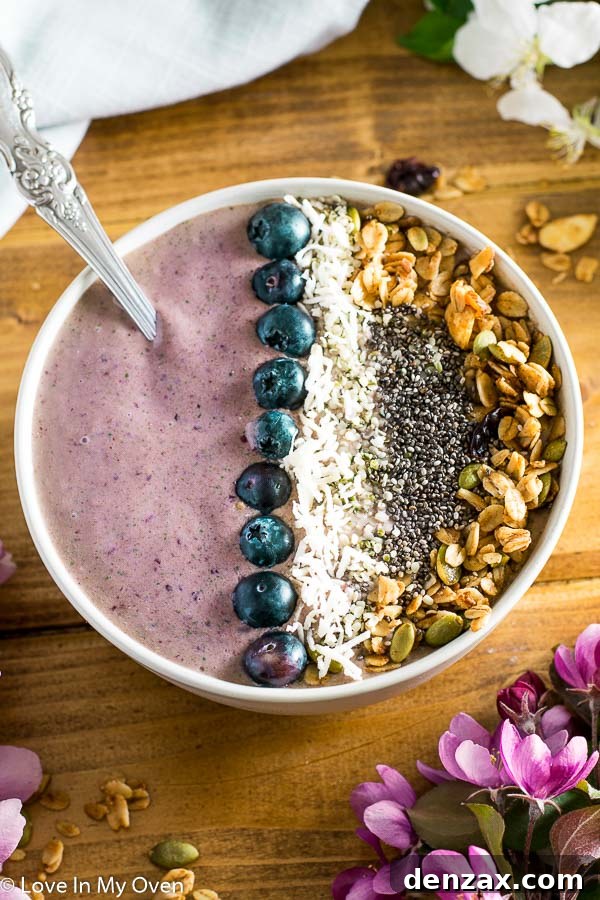 Close-up of a creamy cherry coconut smoothie bowl ready for toppings
