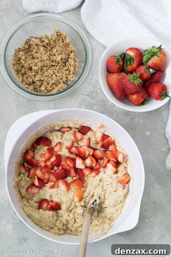 Muffin batter with rhubarb and strawberries