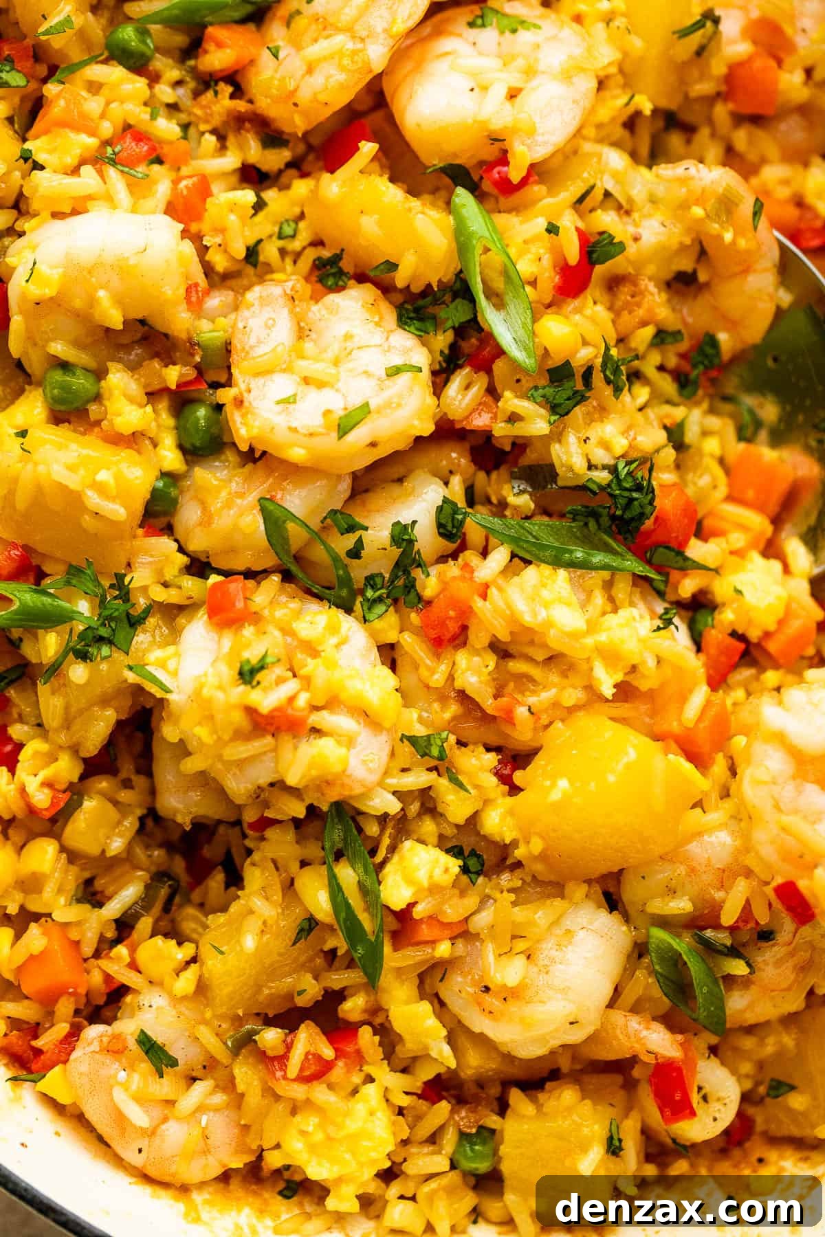 Close-up photo of Easy Shrimp Fried Rice with Pineapple, showcasing the plump shrimp, golden rice, and vibrant vegetables