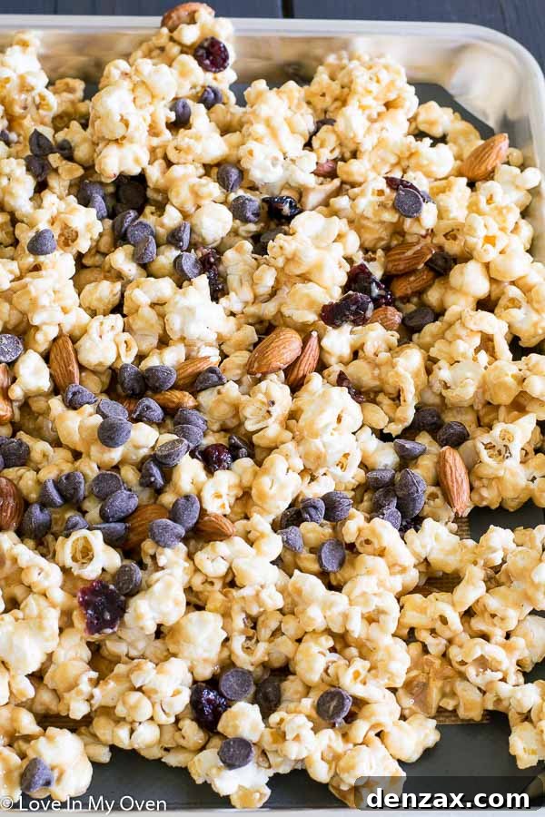 Finished Trail Mix Popcorn on a Baking Sheet