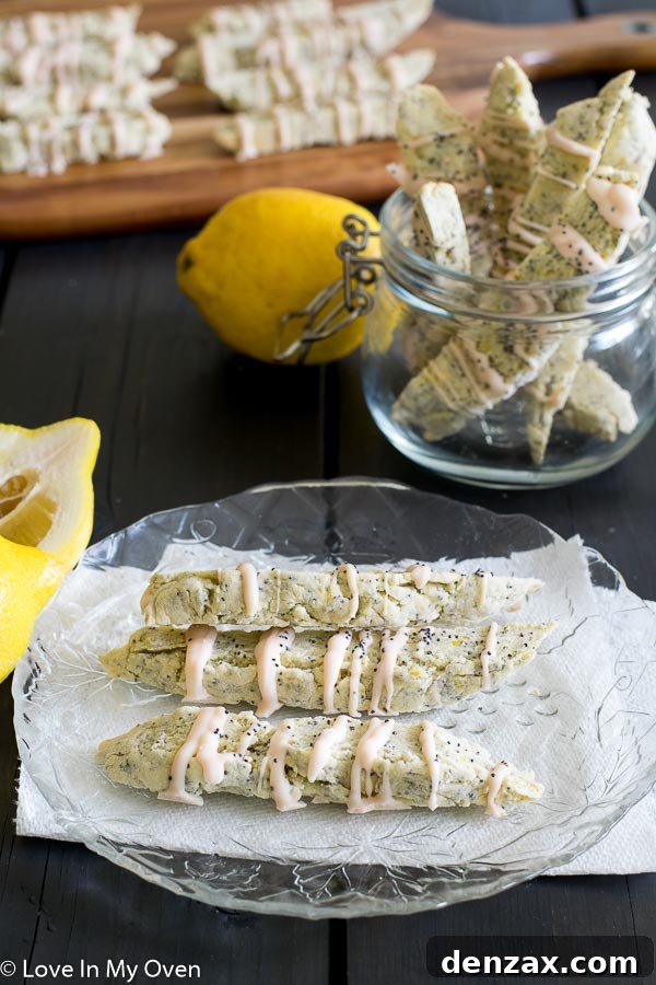 close-up of lemon poppy seed biscotti with white chocolate drizzle