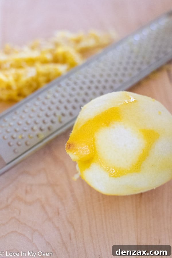 lemon zest, sugar, and poppy seeds being massaged together