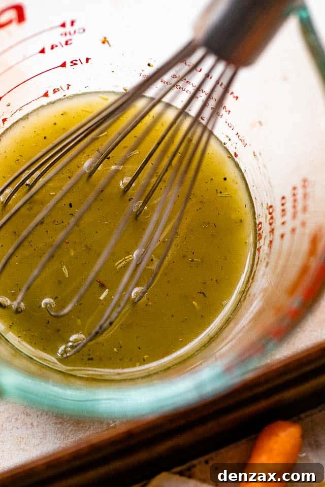whisking homemade lemon vinaigrette
