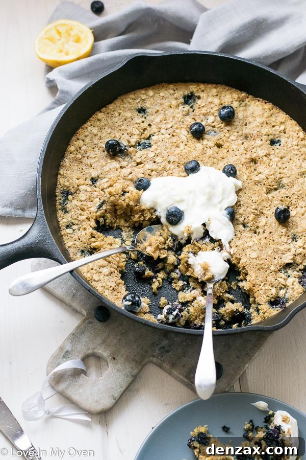 Freshly baked blueberry breakfast cookie in a cast iron skillet