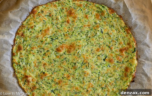 Zucchini pizza crust baking in the oven.