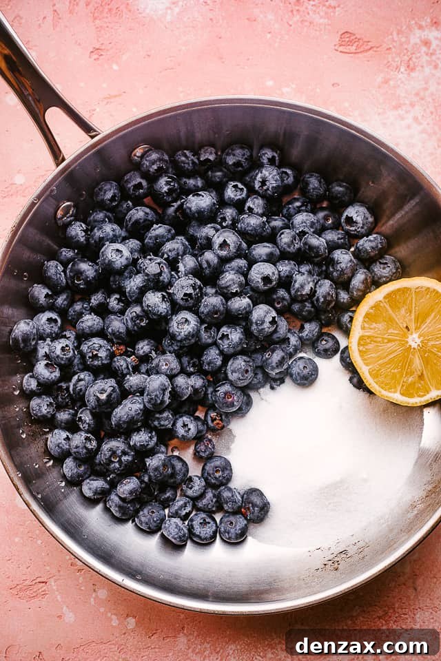 All the ingredients for the blueberry sauce placed into a nonstick skillet, ready for cooking.