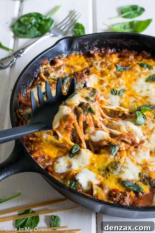 Overhead shot of the creamy skillet linguine in a black cast iron pan, ready to be served.