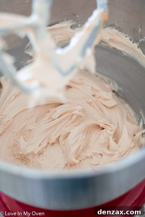 Salted Caramel Apple Cake being frosted