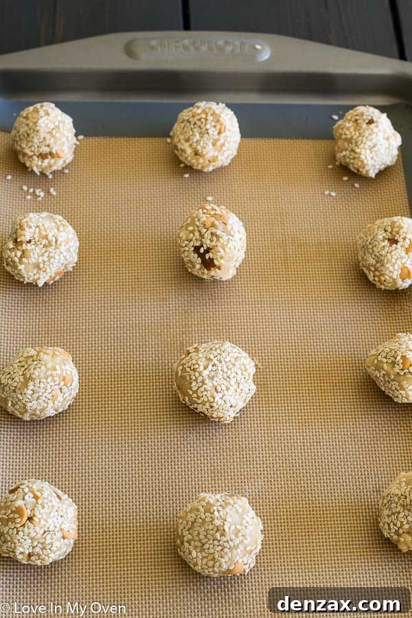 Close-up of ingredients: butterscotch chips, coconut flakes, and sliced almonds