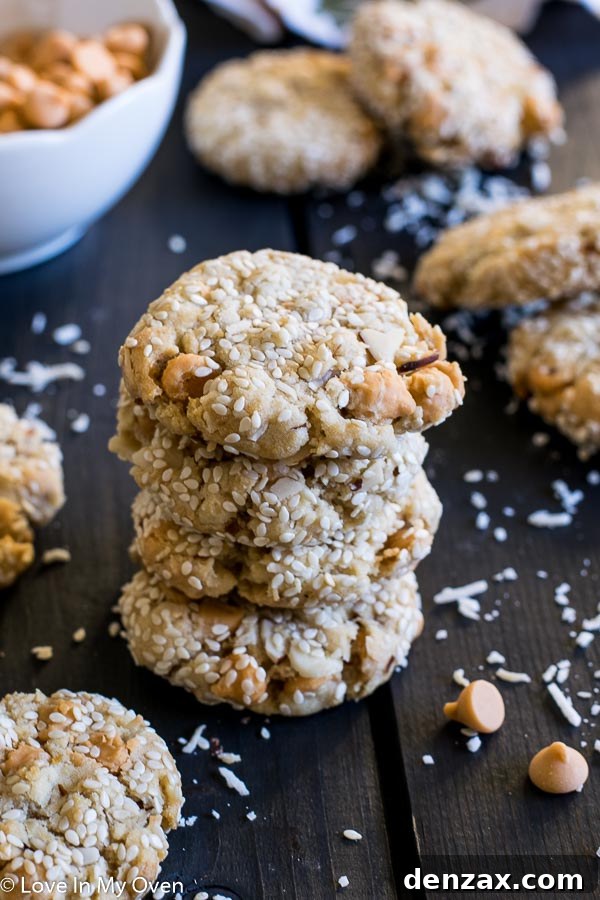 A plate of freshly baked Butterscotch Mountain Cookies with sesame seeds