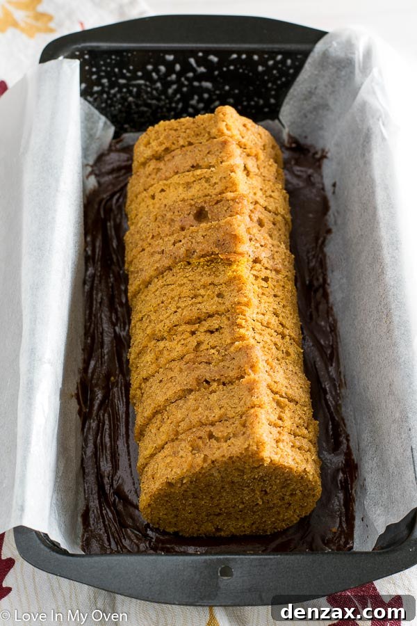 Sliced Peekaboo Pumpkin-Chocolate Loaf revealing a charming pumpkin shape inside