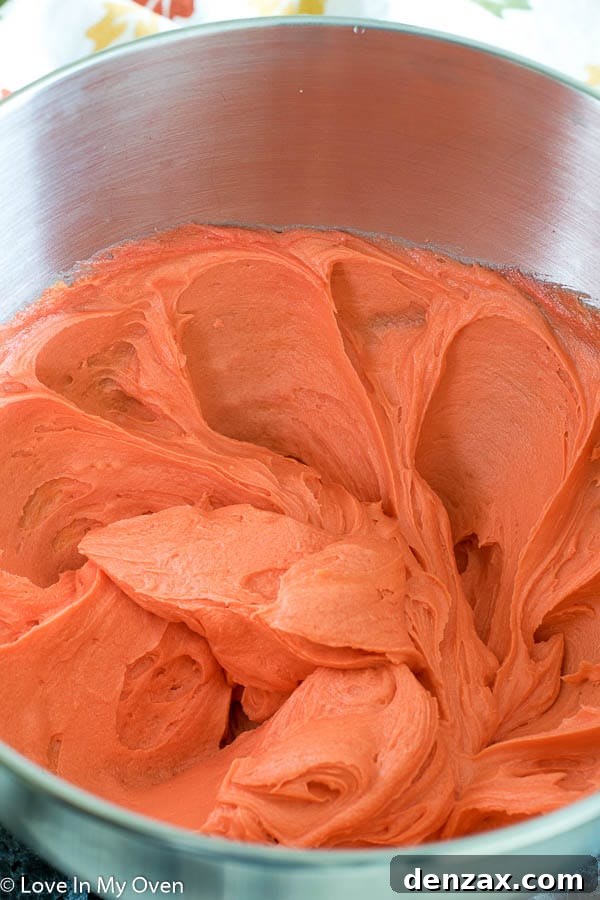 mixing cake crumbs with orange buttercream frosting