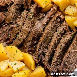 Instant Pot Pot Roast with Carrots and Potatoes on a white plate