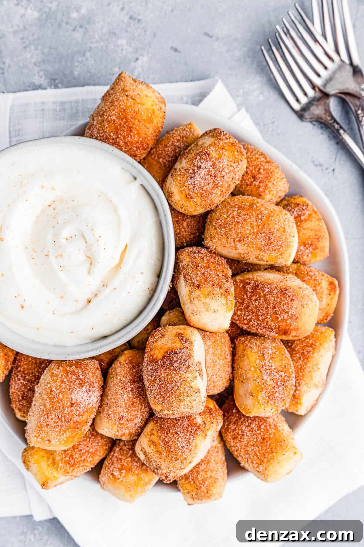 A plate of cinnamon sugar pretzel bites with dip