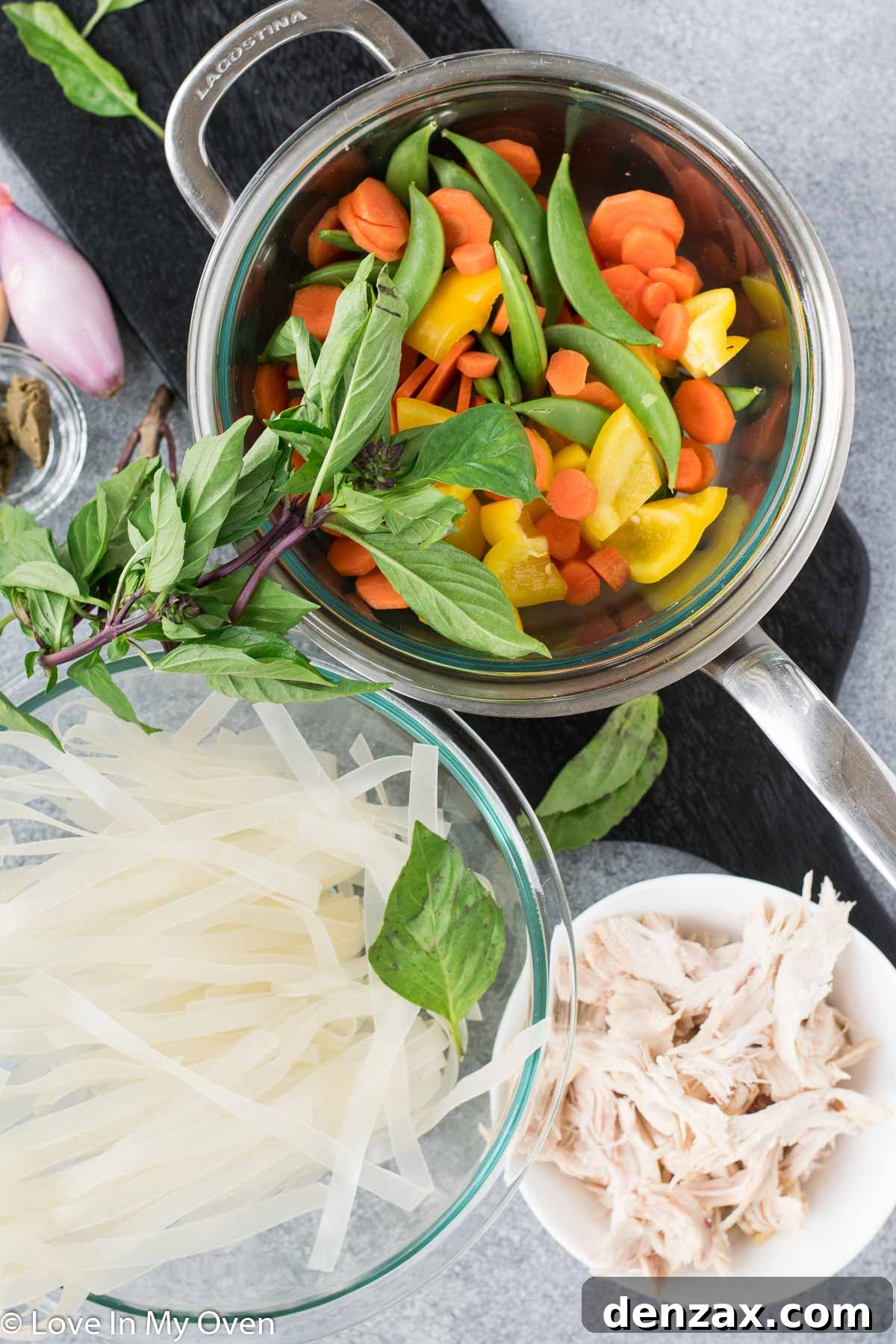 Fresh vegetables and chicken for a Thai noodle soup.