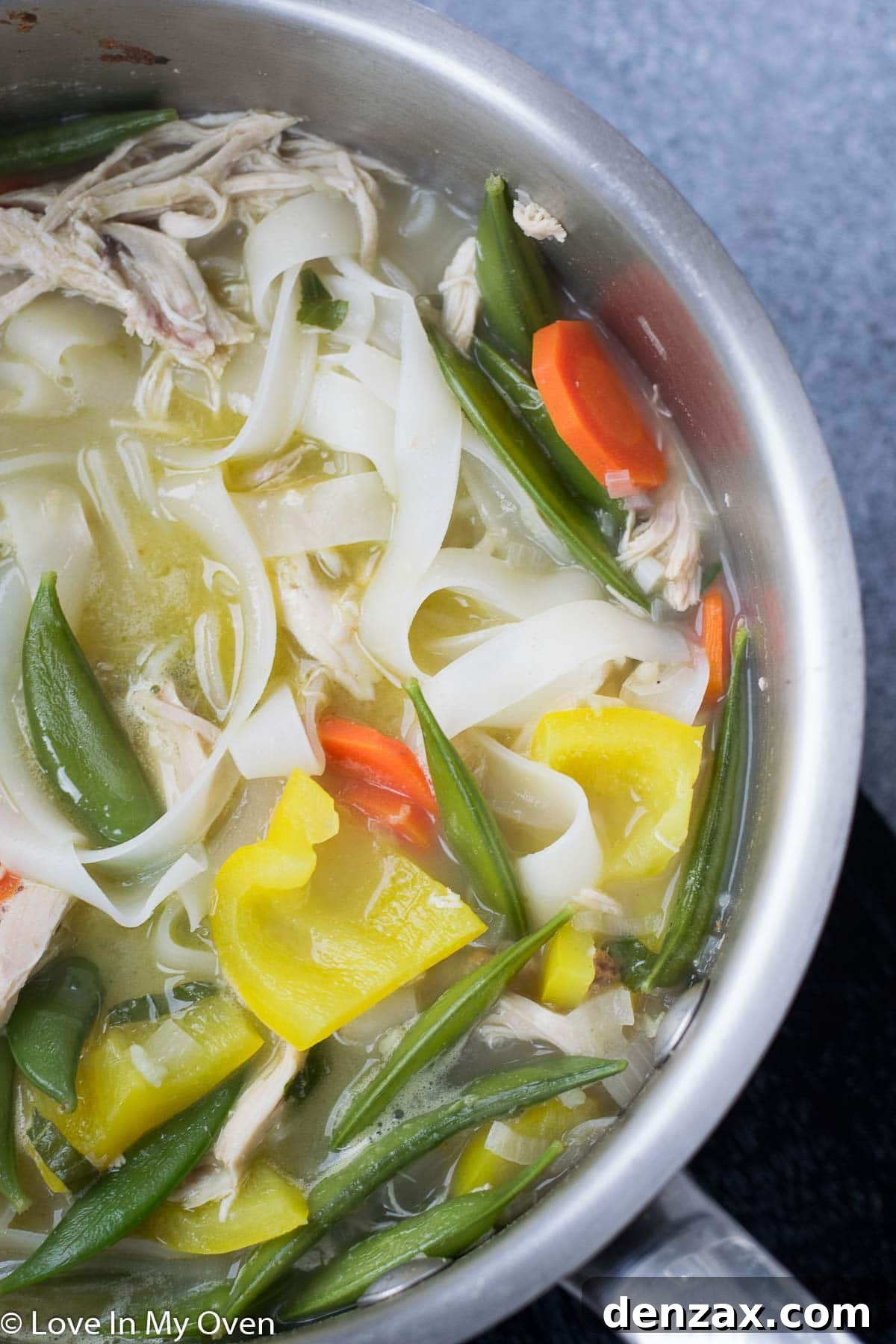 Spicy Thai Chicken Noodle Soup in a bowl, ready to be served.