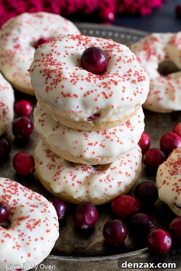 White Chocolate Glazed Cranberry Donuts on a Cooling Rack