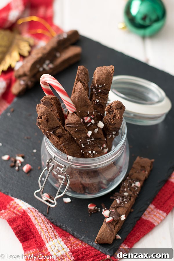 Close-up of freshly baked chocolate peppermint biscotti logs on a baking sheet