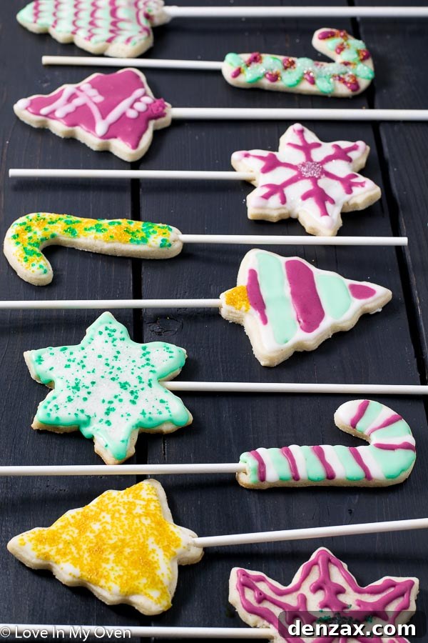 Festive Cookie Pop Treats 2 Festive vanilla bean cookie pops adorned with colorful Christmas icing