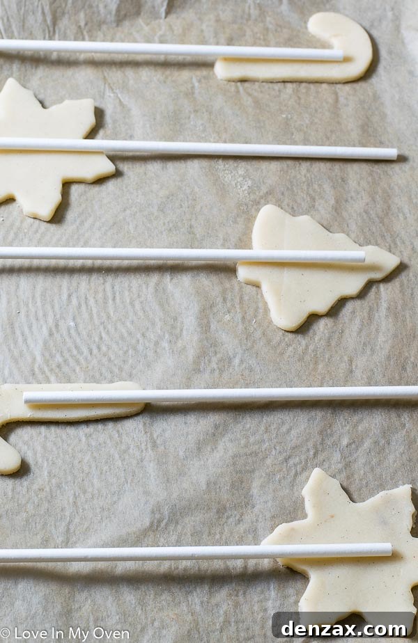 Festive Cookie Pop Treats 3 Rolling out vanilla bean cookie dough to the perfect thickness on a floured surface