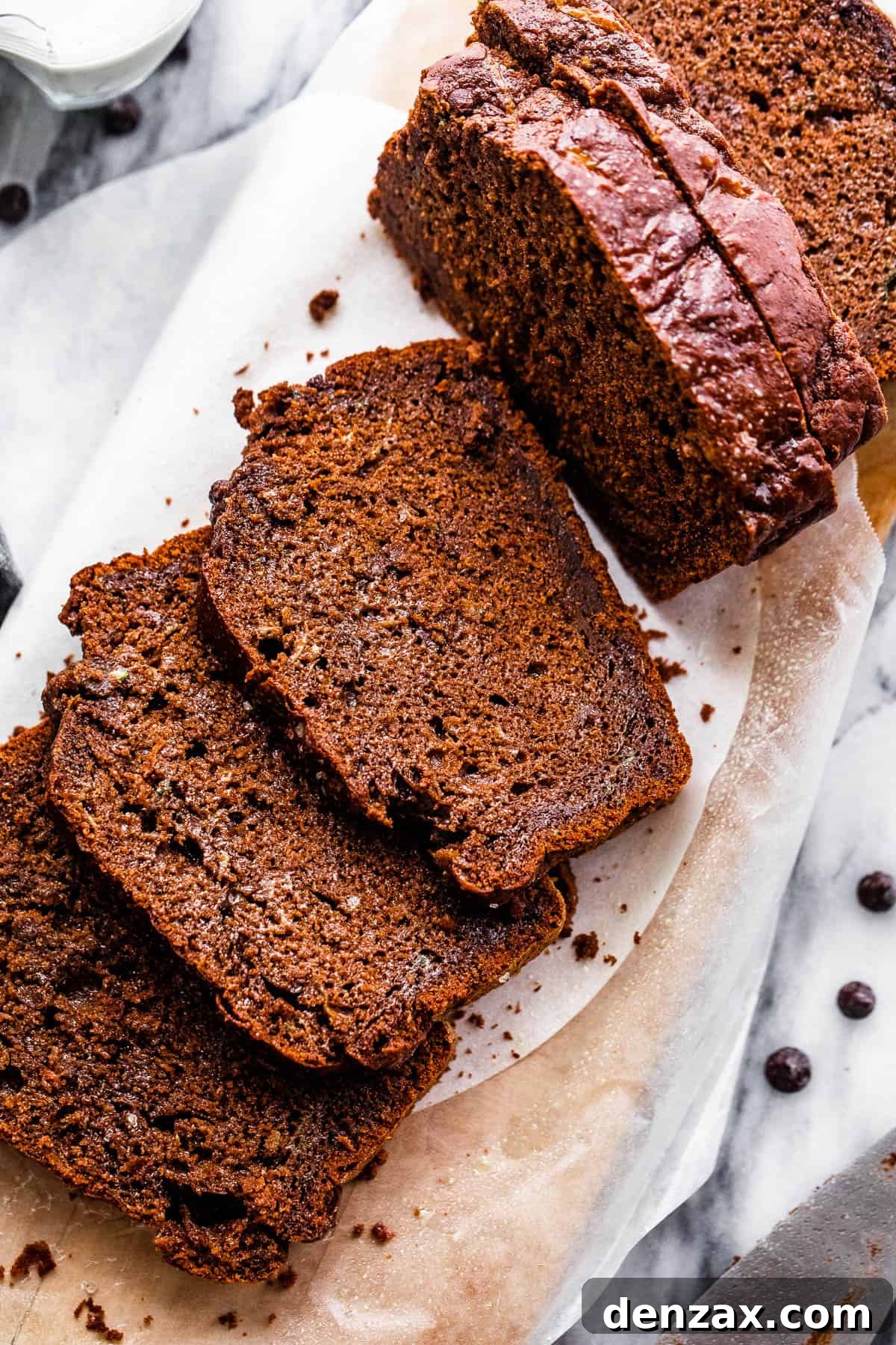 Overhead shot of freshly baked chocolate zucchini bread, sliced and ready to serve