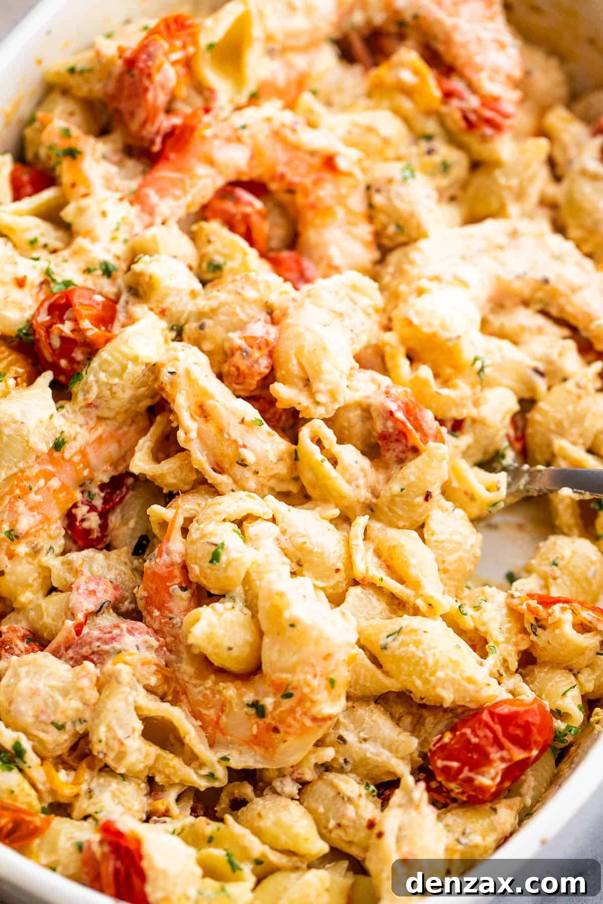 shrimp and pasta tossed with a cream cheese sauce and cherry tomatoes