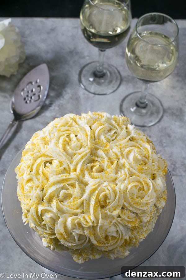 Top-down view of a small chocolate celebration cake, showing intricate cream cheese piping