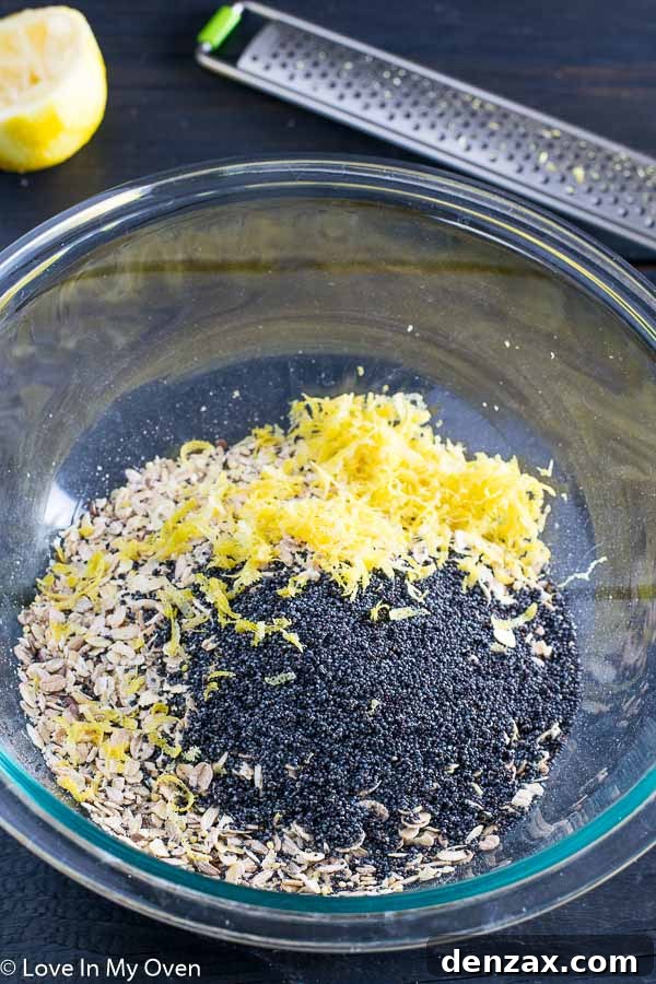 Close-up of lemon poppy seed overnight oats being stirred in a bowl before refrigeration.