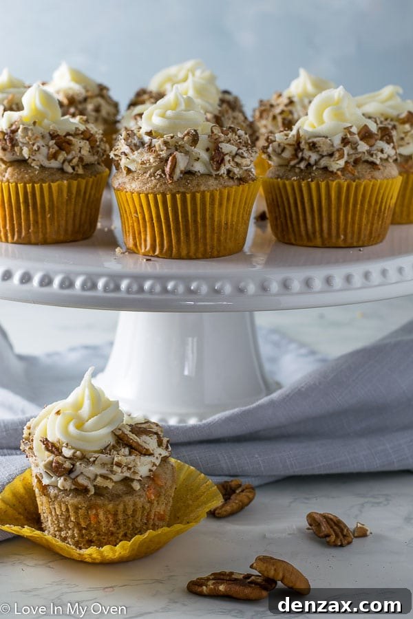 Deliciously moist carrot cake cupcakes topped with cream cheese frosting, ready for any occasion.
