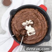 Gluten-free brownie in a skillet, ready to serve.