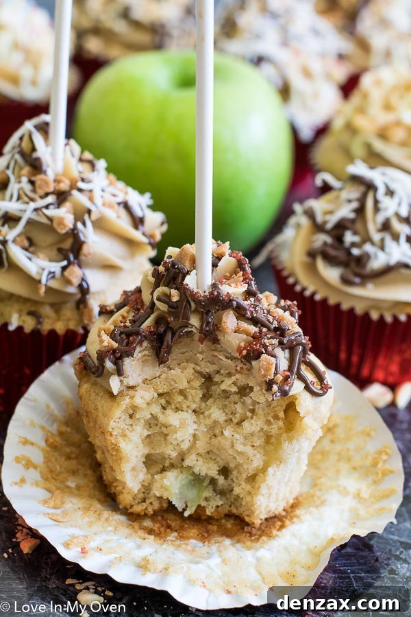 A tray of caramel apple cupcakes, some with lollipop sticks