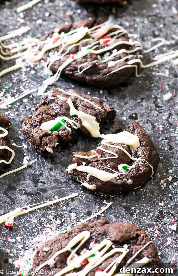 Delicious Mint Chocolate Candy Cane Cookies drizzled with white chocolate on a festive background.