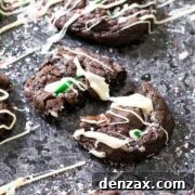 Mint Chocolate Candy Cane Cookies with white chocolate drizzle on a festive plate.