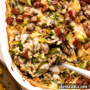 spooning out green bean casserole from a white baking dish.