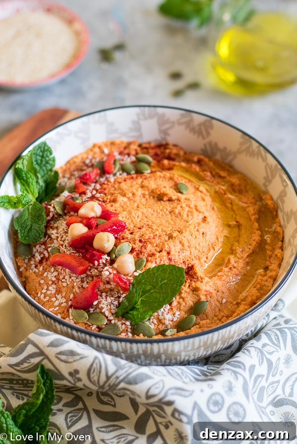 Spicy Roasted Red Pepper Hummus served with fresh vegetables and pita bread