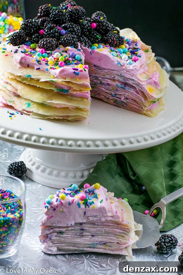 Side view of a tall Funfetti Crepe Cake with many layers, sprinkles visible on top
