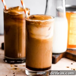 Pumpkin Cream Cold Brew served in two drinking glasses with a milk bottle placed right beside them.