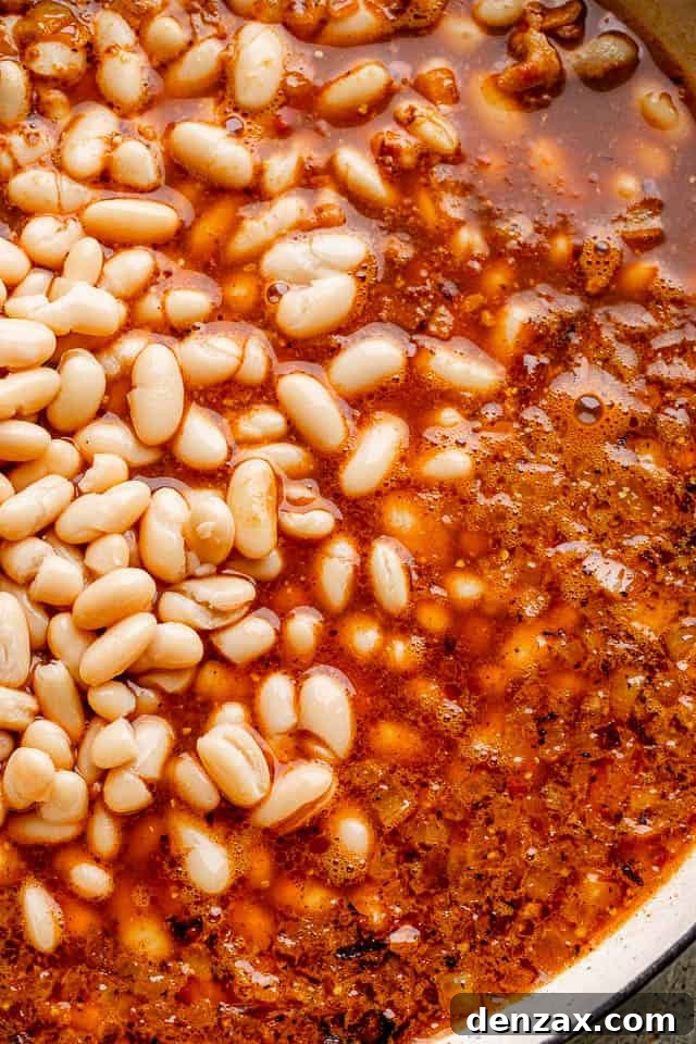 Simmer beans in flavorful sauce boiling beans in broth