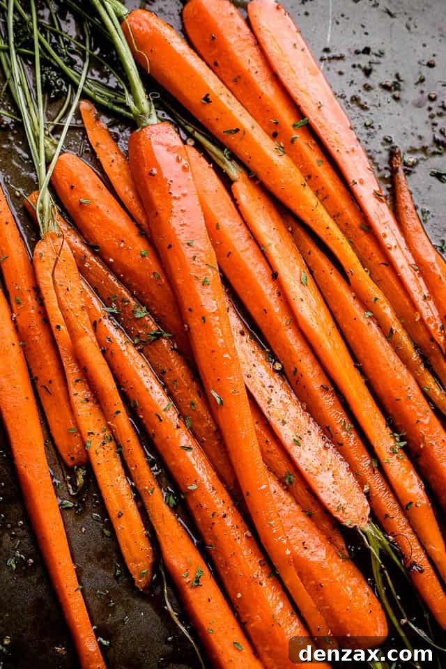 roasted carrots arranged on a baking sheet