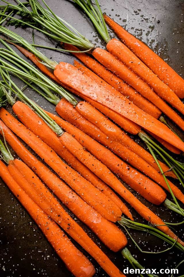 raw carrots cut in half, lengthwise
