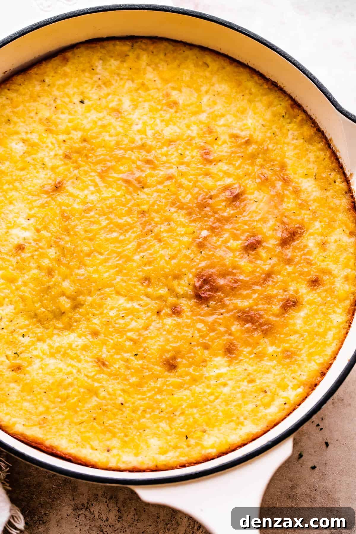 Baked corn pudding in a large skillet.