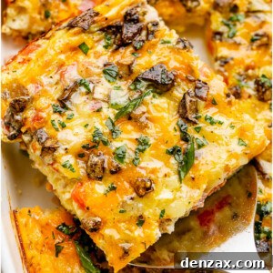 Serving a slice of Baked Denver Omelette topped with fresh parsley.